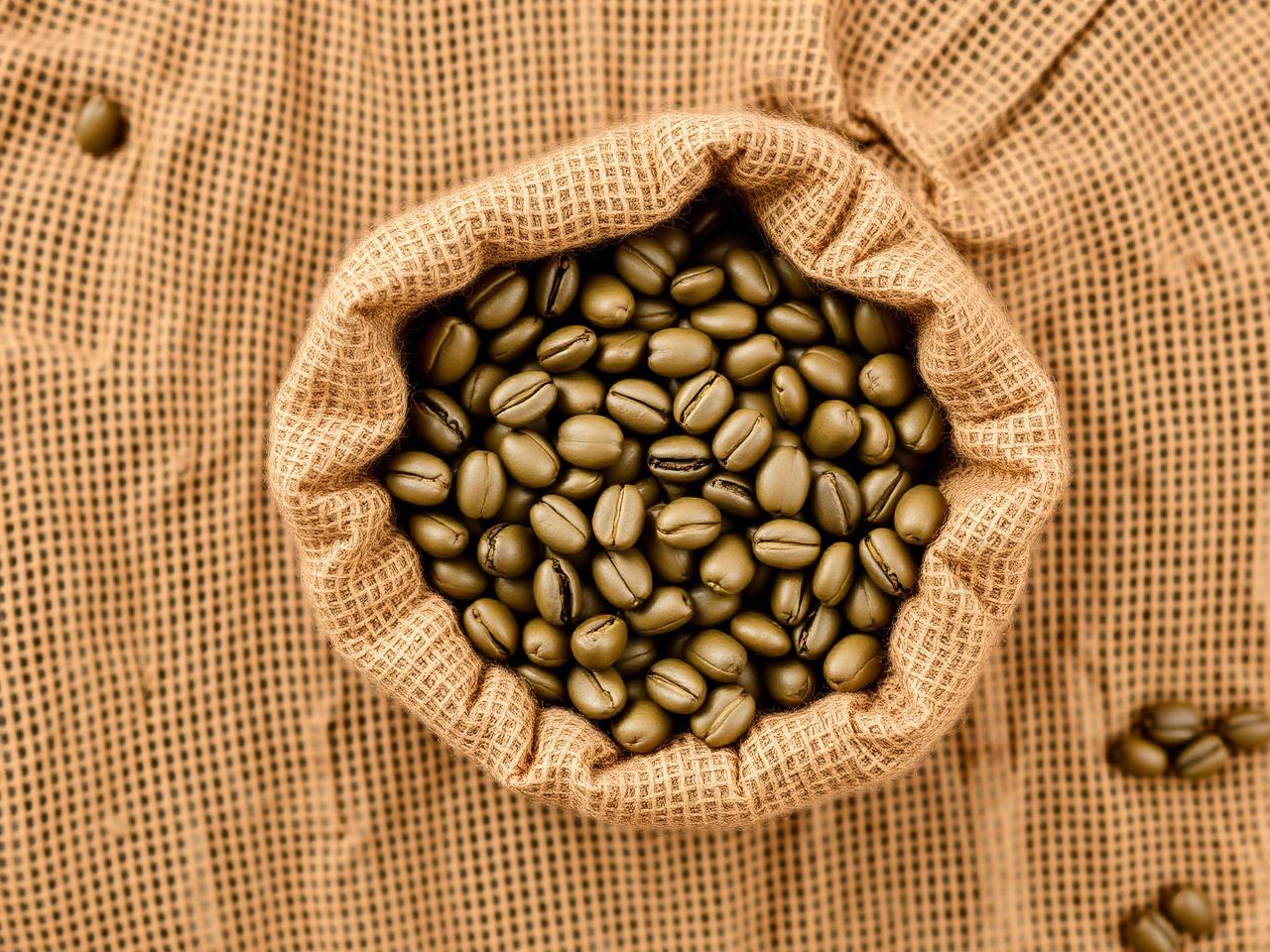 Green coffee beans in burlap